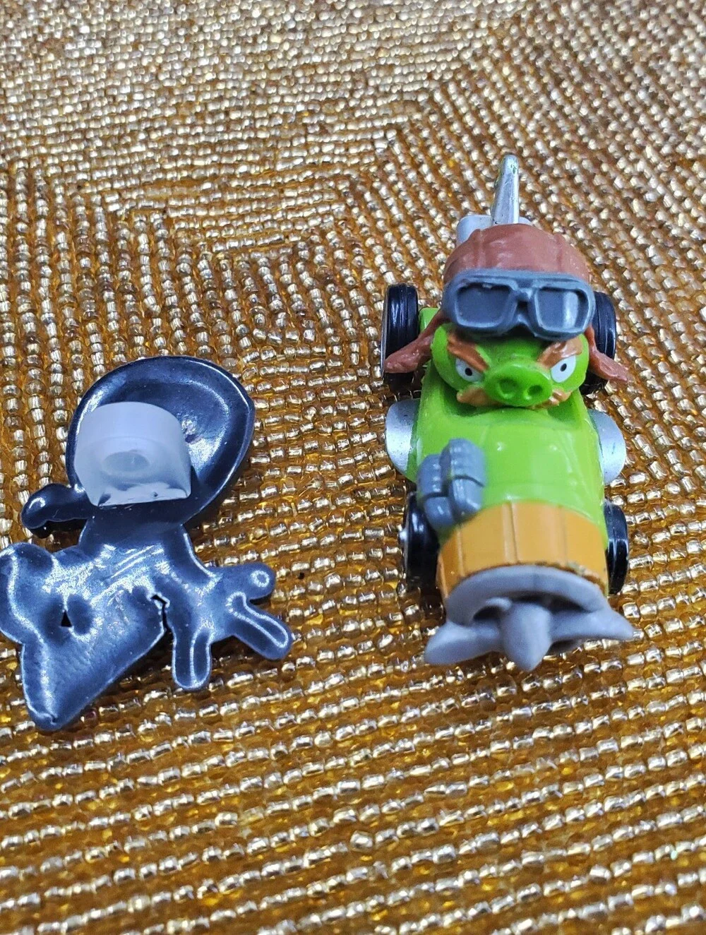 Mix of 9  small toy figures, miniature vehicles, and character charms. (C40)